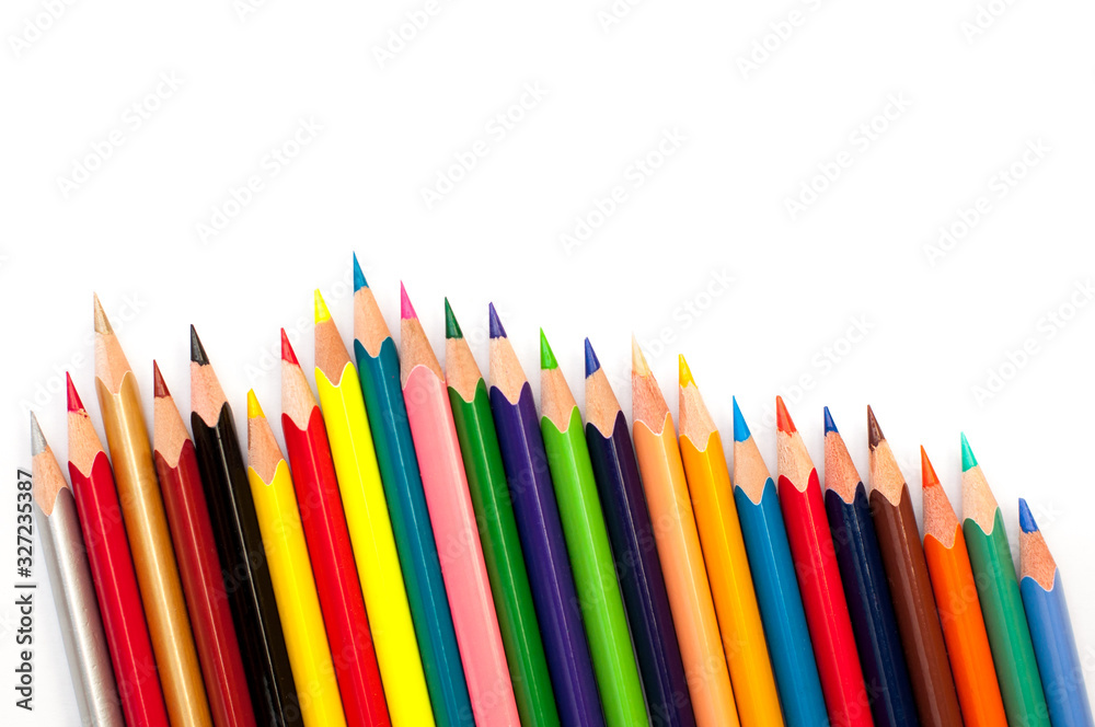 color pencils on a white background in a row, creativity concept color pencils on a white background in a row, creativity concept