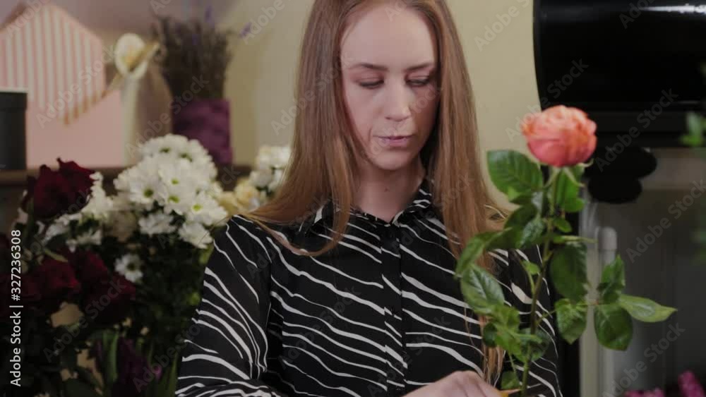 Professional florist collects a composition of flowers. Beautiful bouquet for International Women's Day. Professional florist collects a composition of flowers. Beautiful bouquet for International Women's Day.