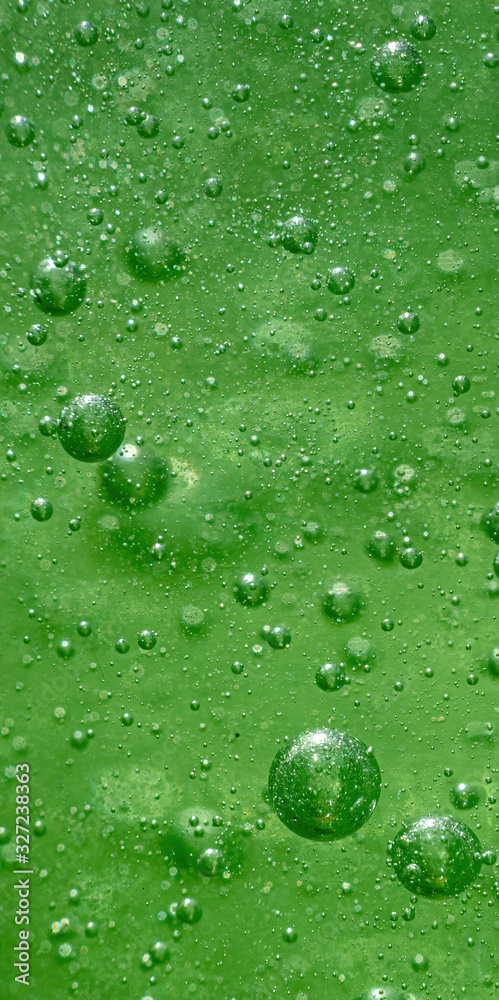 abstract green small bubbles in side a bottle abstract green small bubbles in side a bottle