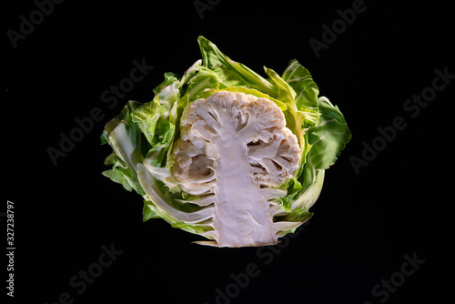  Cauliflower cut in half, on black background