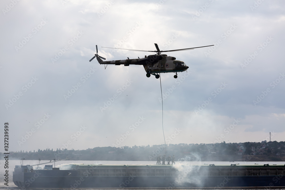A military helicopter picks up a soldier A military helicopter picks up a soldier