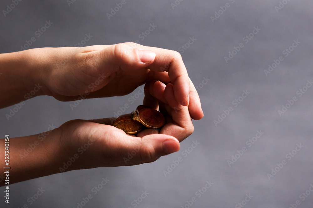 child hold in his little hands money euro on grey background child hold in his little hands money euro on grey background