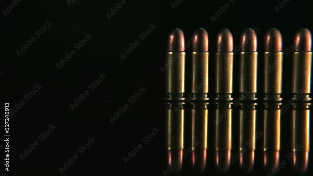 Bullets in a row. Group of bullets on the table slider shoot. Bullets isolated Bullets in a row. Group of bullets on the table slider shoot. Bullets isolated