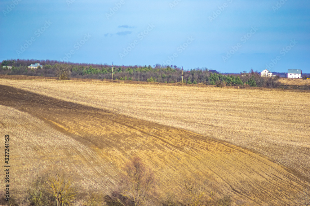 Plowed field in autumn day