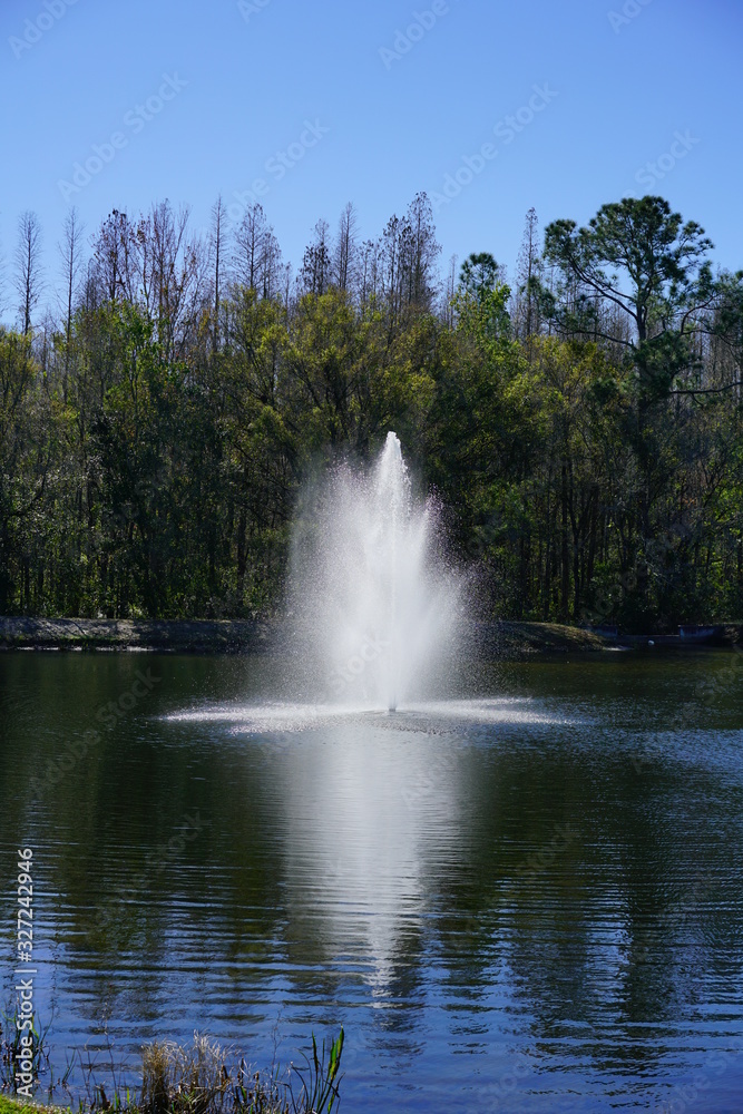 a beautiful blue lake with geyser