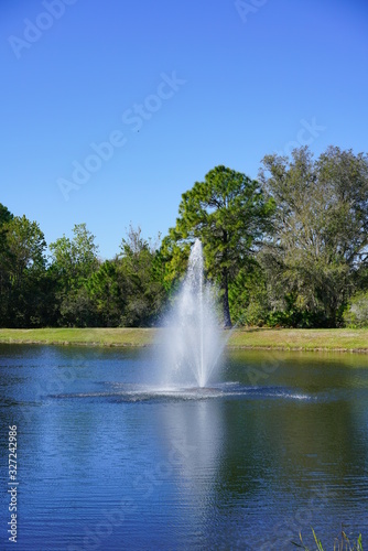 a beautiful blue lake with geyser