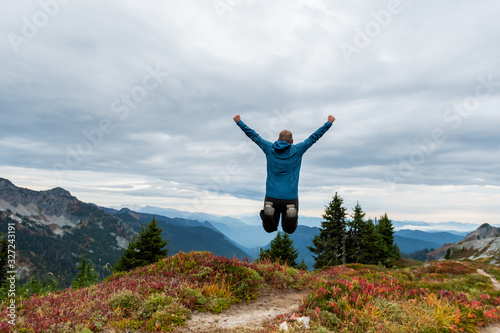 Man Jumps High in Washington Wilderness