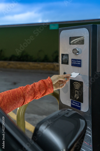 Hand taking a parking ticket photo