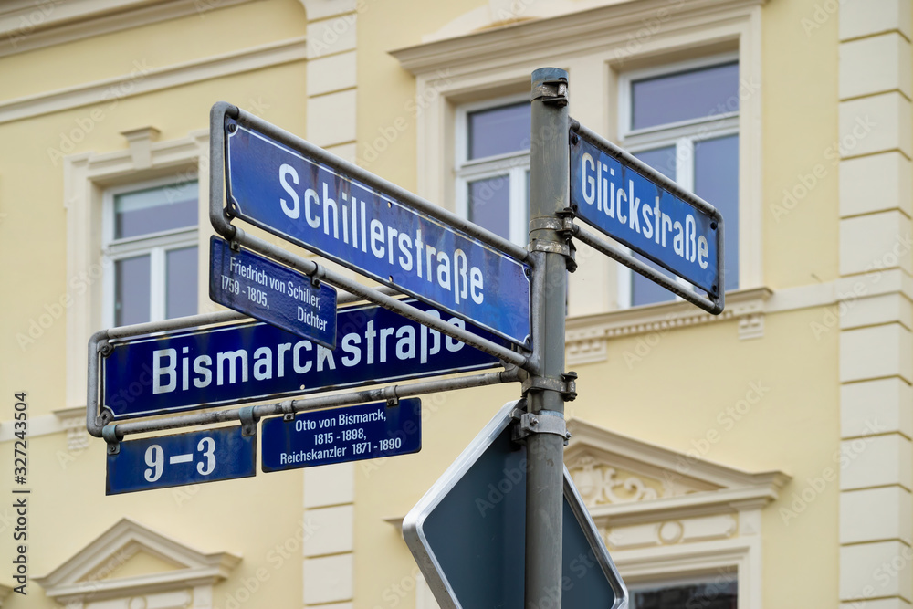 Three-directional street sign in Erlangen, Germany