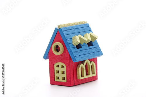 Miniature wooden house, colorful Do It Yourself (D.I.Y) wooden house Isolated on white background.