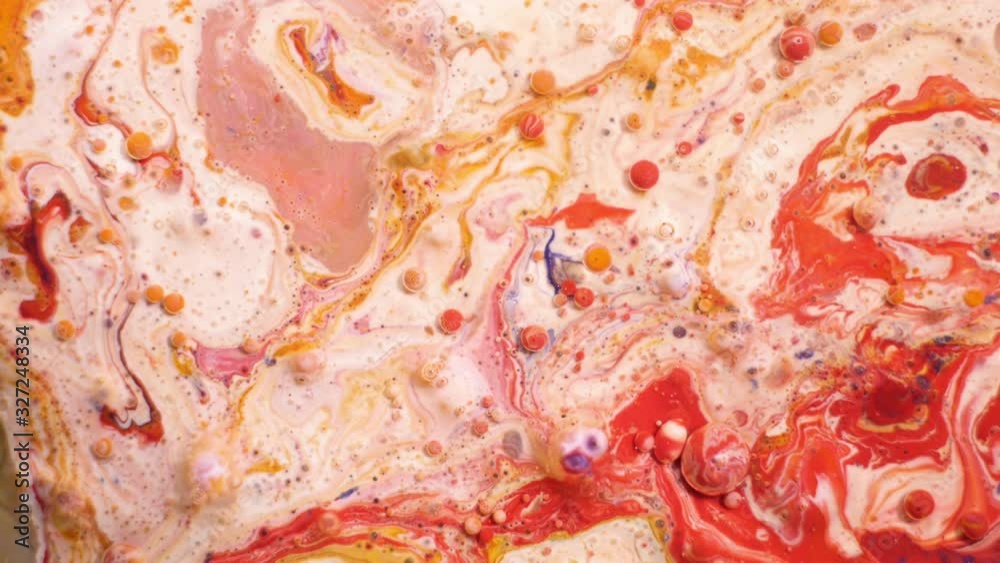 Colorful acrylic paints mix in beautiful patterns. Oil Inks of coral, orange, red and other colors spread over the surface and mix, creating amazing textures and design. Abstract bubbles Colorful acrylic paints mix in beautiful patterns. Oil Inks of coral, orange, red and other colors spread over the surface and mix, creating amazing textures and design. Abstract bubbles