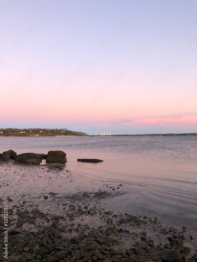 The Northport Smokestacks in the Distance Across the Water Seen From Hobart Beach Park