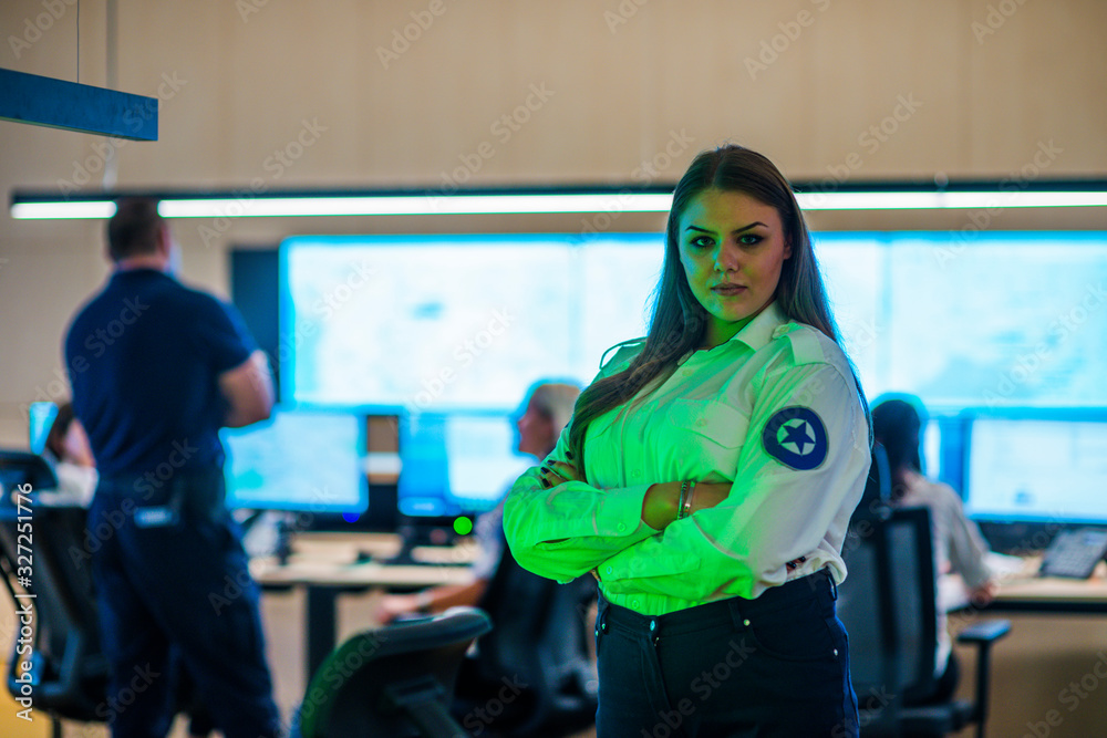 Security guards working in surveillance room, monitoring cctv and discussing. Security guards working in surveillance room, monitoring cctv and discussing.