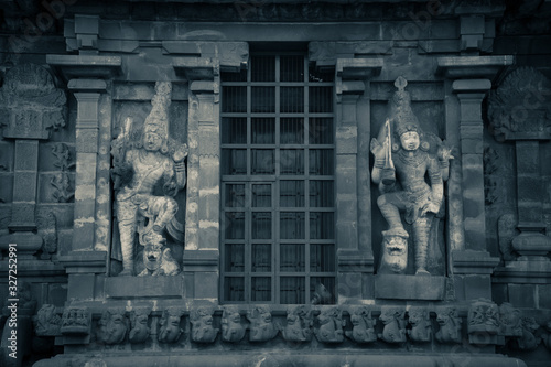 Black and white picture of Lord Bragadeeswarar temple in tanjore tamil nadu with stone sculptures on the wall © karthik raja r