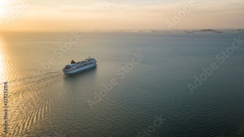 Aerial view Cruise ship at sunset in ocean, Aerial view large cruise ship at sea, Passenger cruise ship vessel, sailing across the Gulf of Thailand.