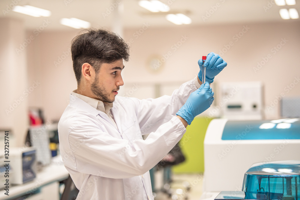 Medical technologists are examining specimens at a hospital laboratory. Medical technologists are examining specimens at a hospital laboratory.