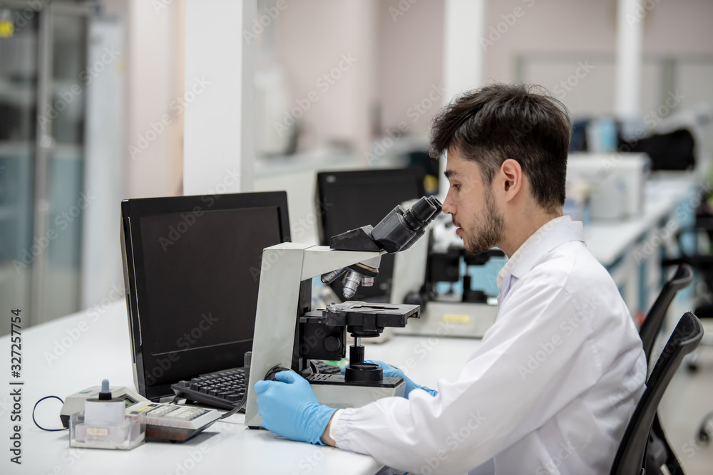 Medical technologists are examining specimens at a hospital laboratory. Medical technologists are examining specimens at a hospital laboratory.