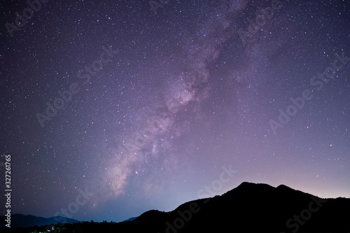 The stars and the milky way in the dark sky at night are very beautiful.