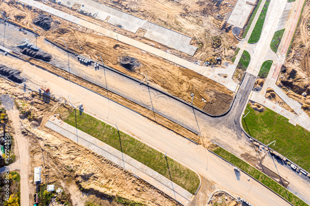 Naklejka premium aerial top down view on road construction site. road junction under construction