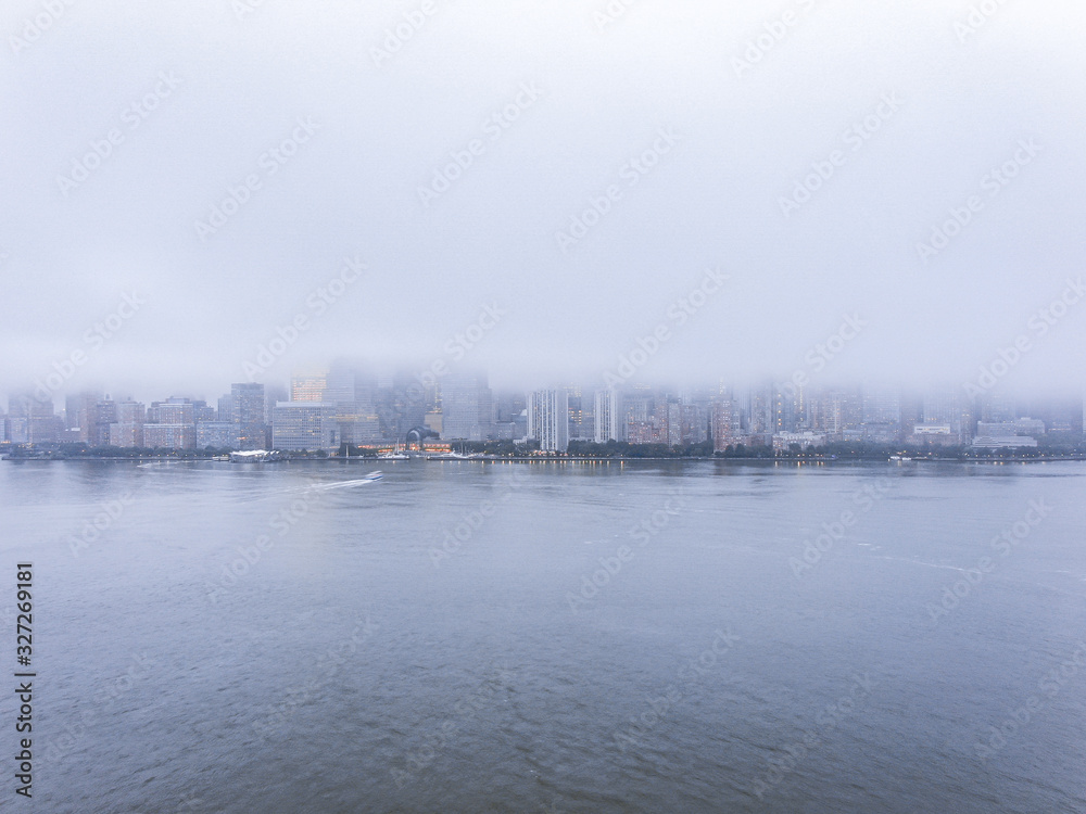 Shot from Jersey City to New York skyline in fog day, aerial photography