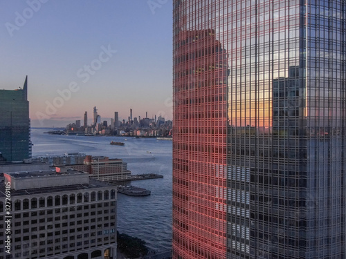 Jersey City Goldman Sachs with New York skyline in sunset, aerial photography photo