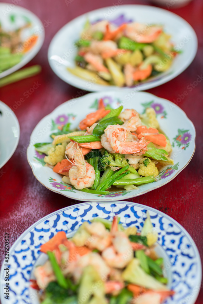 Stir fried vegetables in the plate. Mix vegetable on the cooking pan. Selective focus. Healthy stir fried vegetables in the plate and ingredients close up. Fried vegetables Thai style on plate. Stir fried vegetables in the plate. Mix vegetable on the cooking pan. Selective focus. Healthy stir fried vegetables in the plate and ingredients close up. Fried vegetables Thai style on plate.