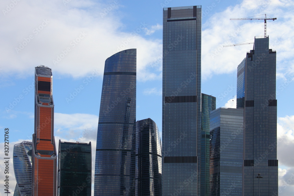 Moscow city business center tall towers on blue sky background, modern buildings development in Russia