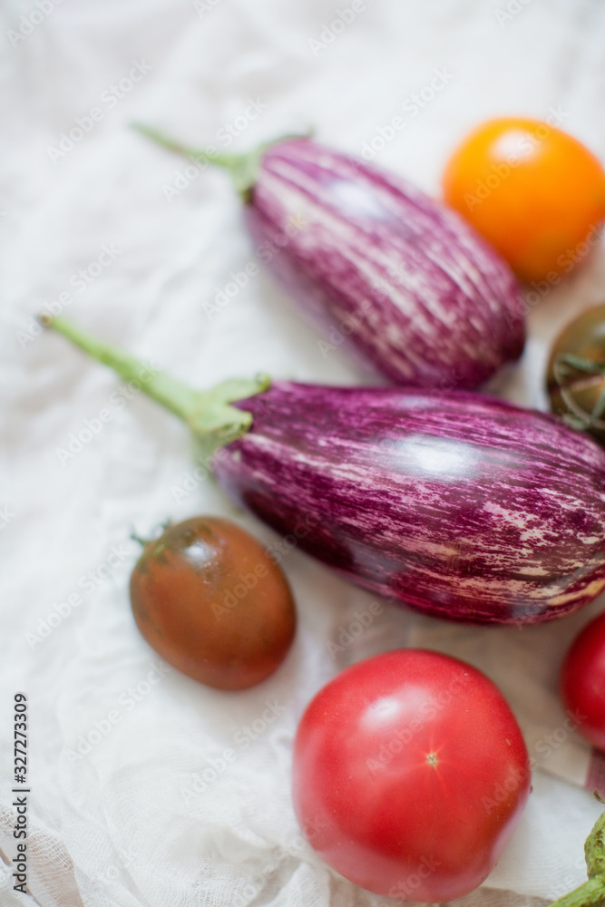 Fresh raw eggplants, tomatoes and parsley Fresh raw eggplants, tomatoes and parsley