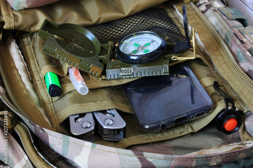 Compass and phone in a backpack