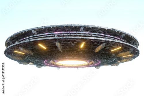 Fototapeta UFO, an alien plate soars in the sky, hovering motionless in the air