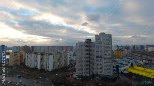 Cloudy sunset timelapse in the city photo