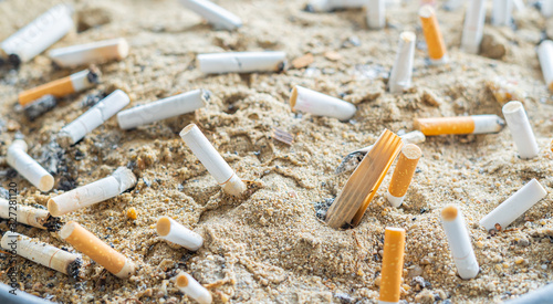 Cigarette butts in the ashtray tray