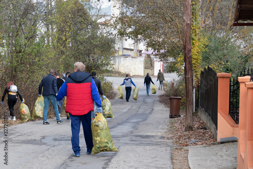 People gathering litter from nature