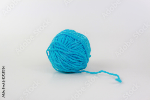Cyan yarn with curl isolated on white background