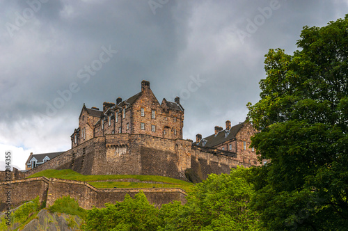 Edinburgh Castle silhouetted against a cloud-laden sky. Concept: famous castles of Scotland
