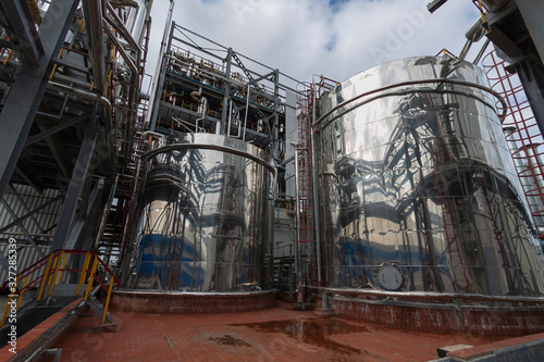Reaction tanks at a chemical plant for the production of mineral fertilizers, nitric acid, ammonia, phosphorus fertilizers, ammonium, nitrate. In the daytime.