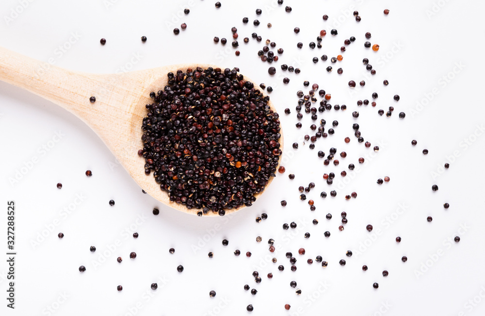 Healthy diet concept. Black quinoa in round wooden spoon Healthy diet concept. Black quinoa in round wooden spoon