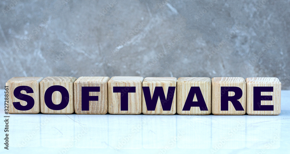 Obraz premium concept word software on cubes on a marble grey background