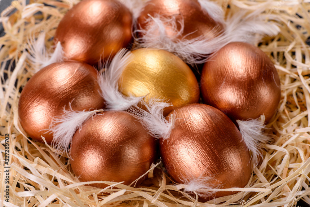 Easter golden eggs in the nest, preparation for the holiday Easter golden eggs in the nest, preparation for the holiday