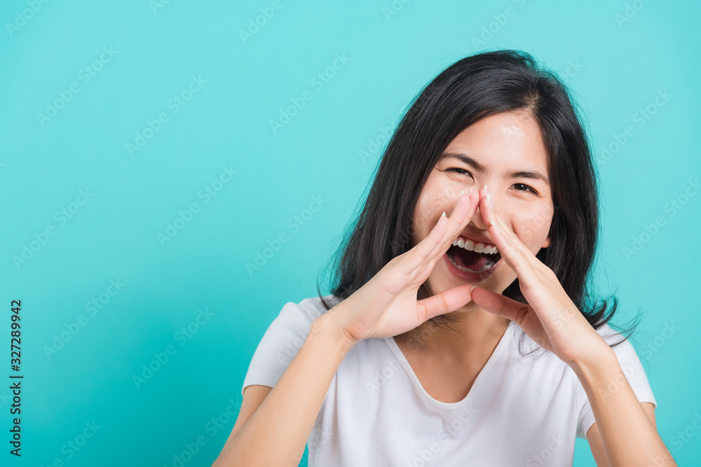 woman smile wear white t-shirt standing shouting with hands cover mouth woman smile wear white t-shirt standing shouting with hands cover mouth