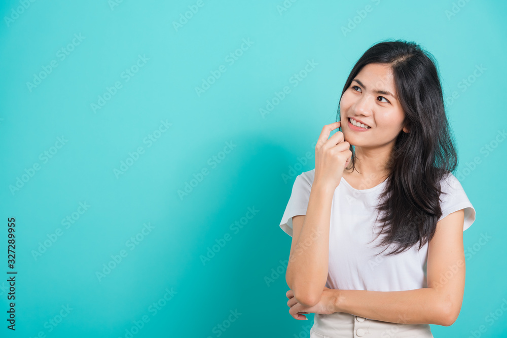 woman smile wear white t-shirt standing relaxed thinking about something about question woman smile wear white t-shirt standing relaxed thinking about something about question
