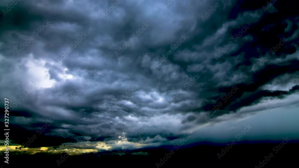 Timelapse  black clouds  move and gathered,condense into a rain cloud a heavy rain