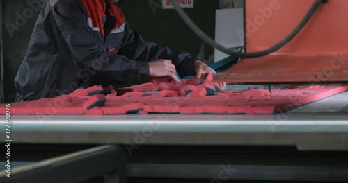 Plant for production of paralon products, stamping of sponges for washing tiles and dishes, hexagonal shape, paralon products, man pull red sponges from cut sheet of synthetic material, low paying job