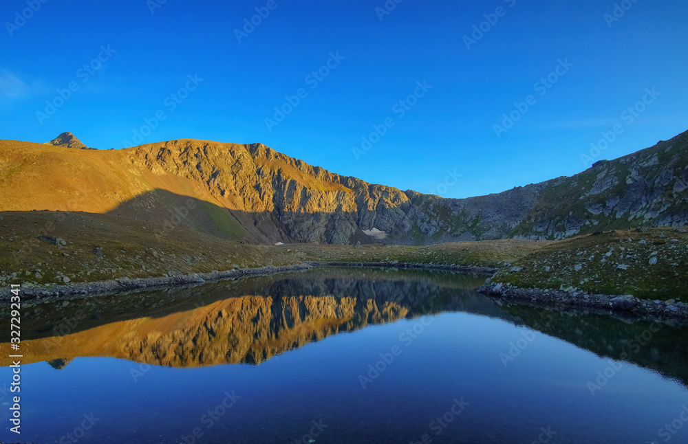  Mountain lake with reflection. Good light, clear sky. Background picture.