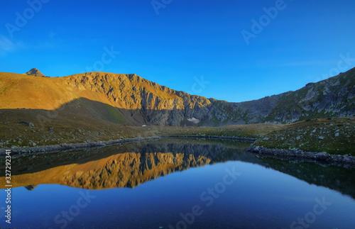  Mountain lake with reflection. Good light, clear sky. Background picture.