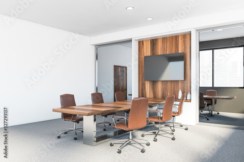 Modern white and grey meeting room with TV