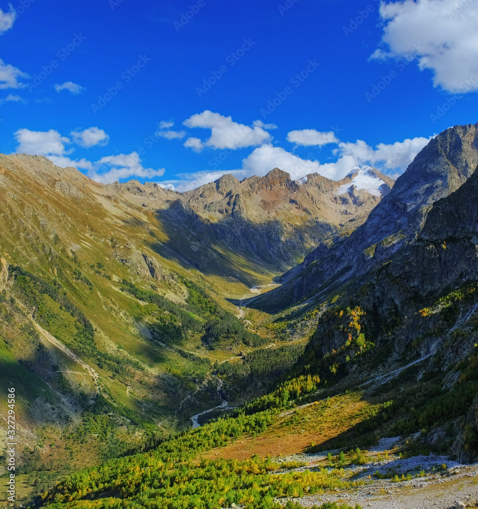 Mountain valley. Beginning of autumn. Beautiful landscape. Background image.