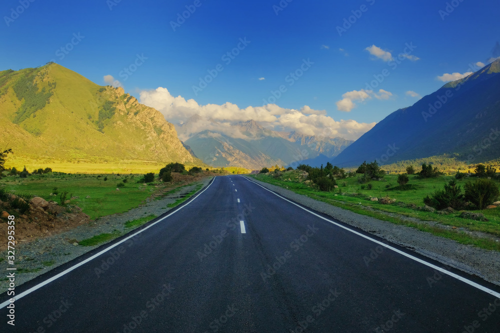 The road goes uphill. Beautiful view. Good light. Outdor The road goes uphill. Beautiful view. Good light. Outdor