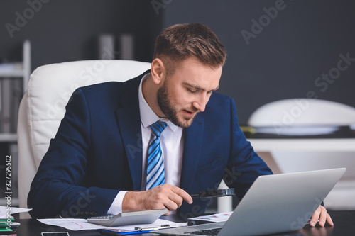 Male accountant working in ...