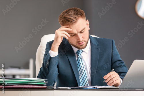 Male accountant working in ...